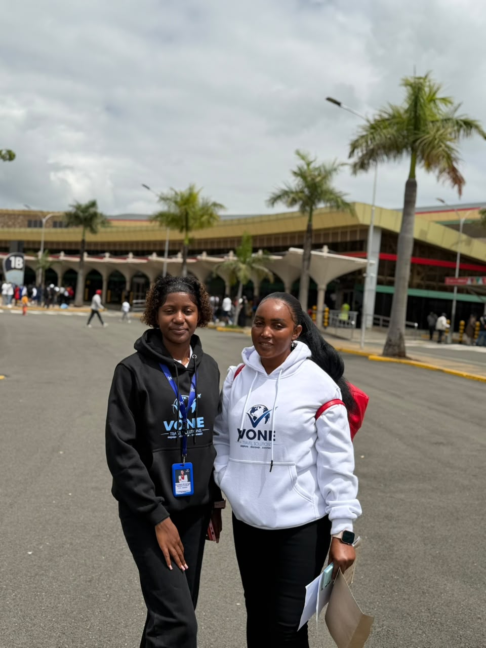 Vone Travel Solutions staff with a client at the airport